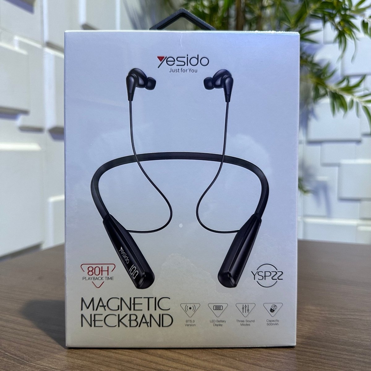 Box of Yesido magnetic neckband on a wooden surface with a blurred indoor background