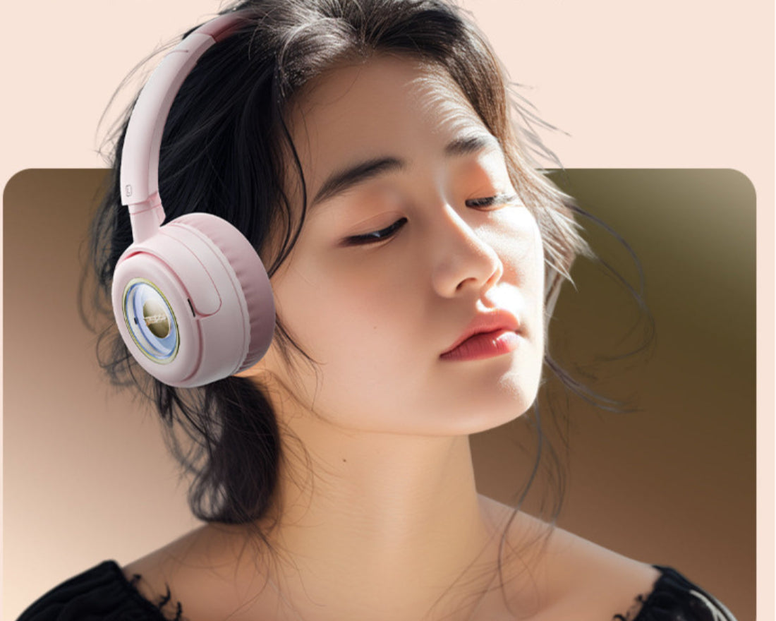 Woman wearing pink headphones with a soft background
