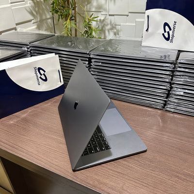 Apple MacBook Pro 2018 - Intel Core i9 - 500GB SSD - 16GB RAM - 4GB Dedicated Graphics - Touch ID - Touch Bar - Keyboard Light - (Minor body dent)