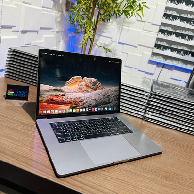 Apple MacBook Pro 2018 - Intel Core i7 - 500GB SSD - 16GB RAM - 4GB Dedicated Graphics - Touch ID - Touch Bar - Keyboard Light - (Minor body scratch)